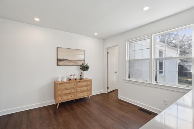 interior space featuring dark wood-style floors, visible vents, and recessed lighting