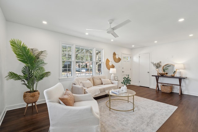 living room featuring a ceiling fan, recessed lighting, dark wood-style floors, and baseboards