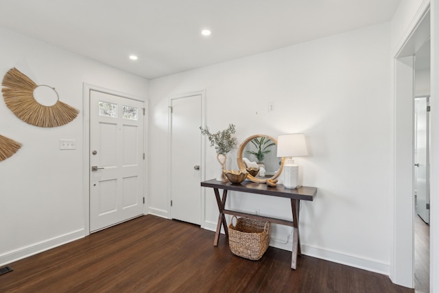 entryway with recessed lighting, visible vents, baseboards, and wood finished floors