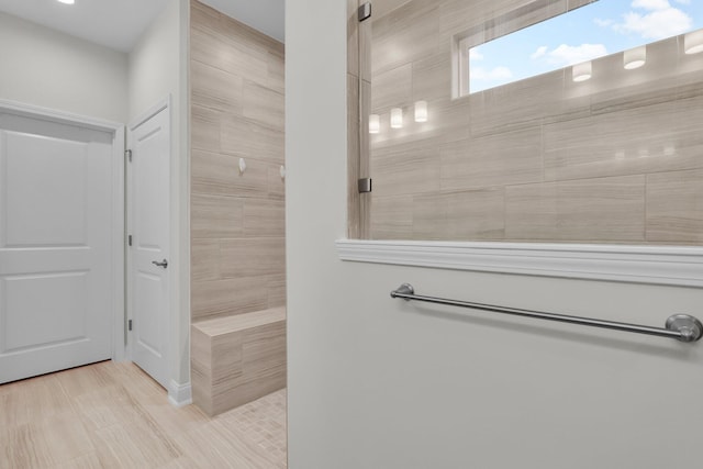 bathroom featuring tiled shower