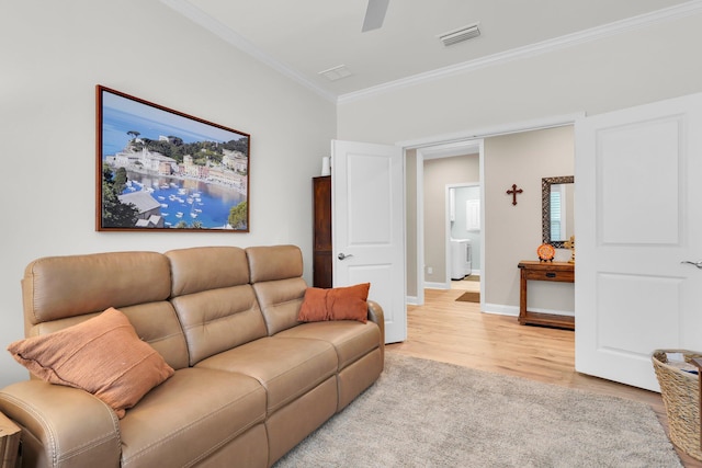 living room with ceiling fan, light wood-type flooring, and crown molding