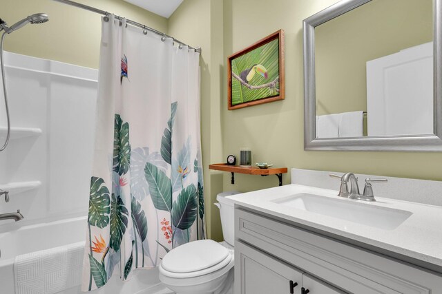 full bathroom with vanity, toilet, and shower / bathtub combination with curtain