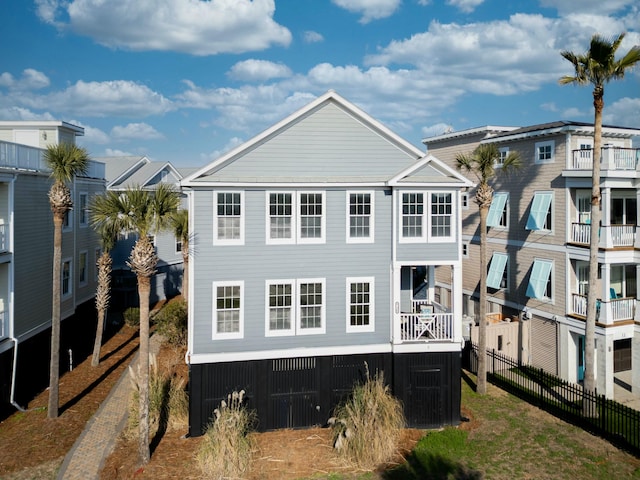 back of house with fence