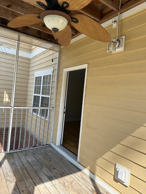 doorway to property with ceiling fan