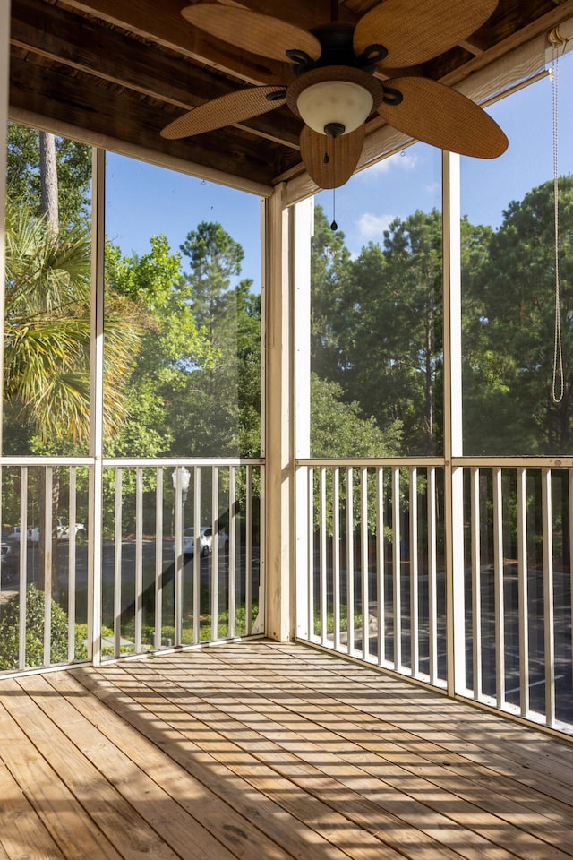 wooden deck featuring a ceiling fan