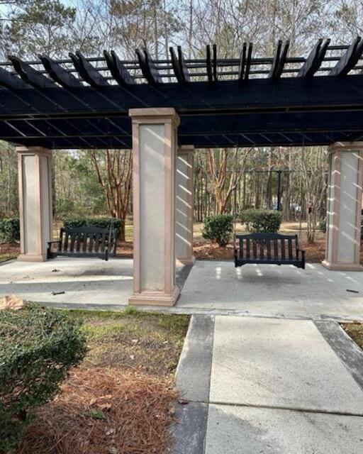 exterior space with a patio area and a pergola