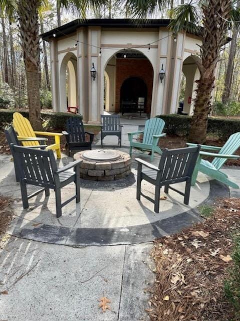 view of patio / terrace with an outdoor fire pit