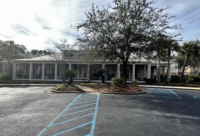 view of property featuring uncovered parking