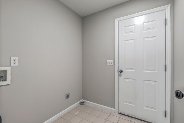 laundry area with light tile patterned flooring, hookup for a washing machine, hookup for an electric dryer, laundry area, and baseboards