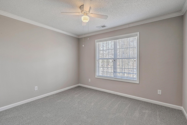 empty room with carpet floors, visible vents, ornamental molding, and baseboards