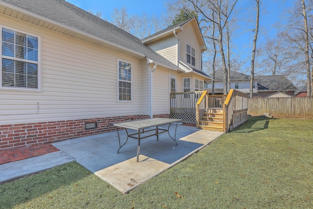 exterior space featuring a wooden deck and fence