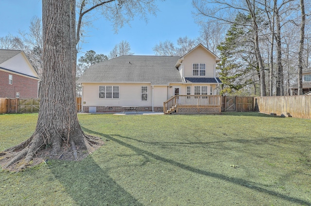 rear view of house with crawl space, a fenced backyard, a lawn, and a deck