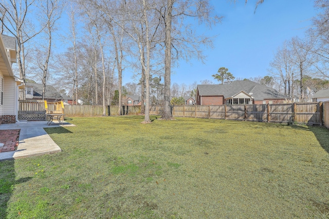 view of yard featuring a fenced backyard, a patio, and a deck