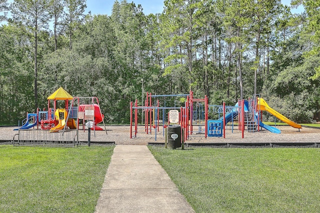 community playground featuring a lawn