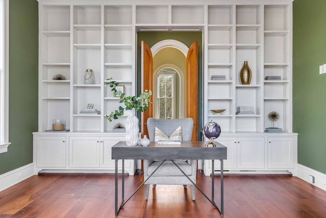 office space with dark wood-style floors and baseboards