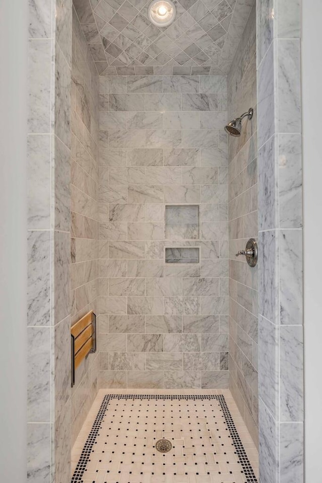 full bathroom with a tile shower