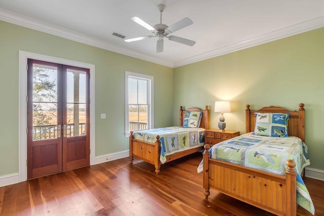 bedroom with visible vents, ornamental molding, dark wood-style flooring, access to outside, and french doors