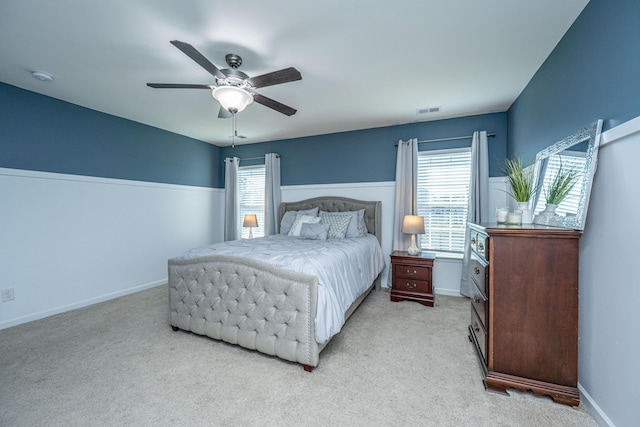 458 Whispering Breeze Ln, Summerville, SC 29486 - bedroom featuring light carpet, visible vents, multiple windows, and a ceiling fan