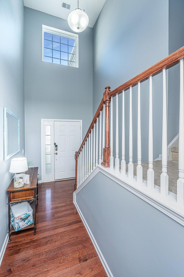 458 Whispering Breeze Ln, Summerville, SC 29486 - entrance foyer with visible vents, a high ceiling, wood finished floors, stairs, and baseboards