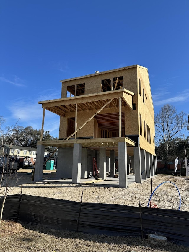 back of property featuring stucco siding