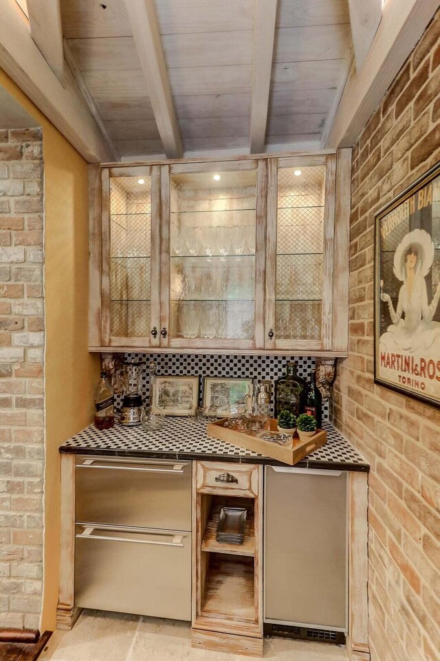bar with wood ceiling, beam ceiling, and brick wall