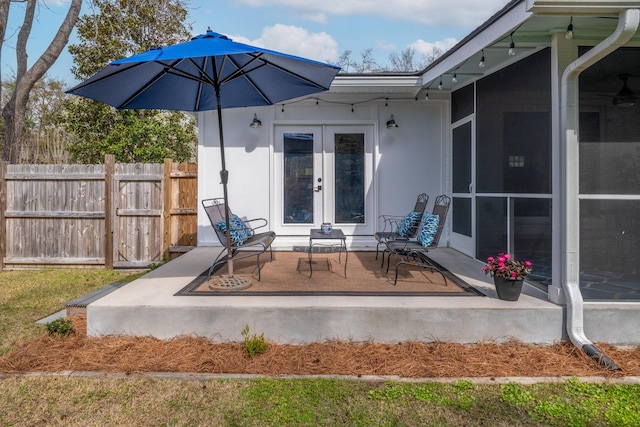 2137 Barbour Dr, Charleston, SC 29414 - view of patio / terrace featuring french doors, a sunroom, and fence