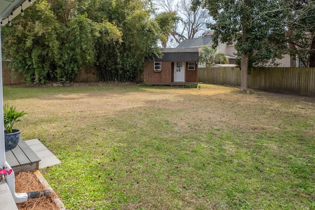 2137 Barbour Dr, Charleston, SC 29414 - view of yard with an outbuilding, a fenced backyard, and a storage shed