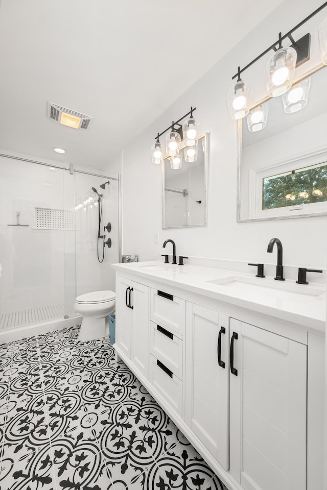 2137 Barbour Dr, Charleston, SC 29414 - bathroom with a sink, visible vents, a stall shower, and double vanity