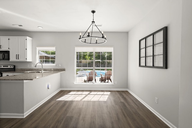 132 E Hartwick Ln, Goose Creek, SC 29445 - unfurnished dining area with baseboards, a sink, dark wood-style flooring, and a notable chandelier
