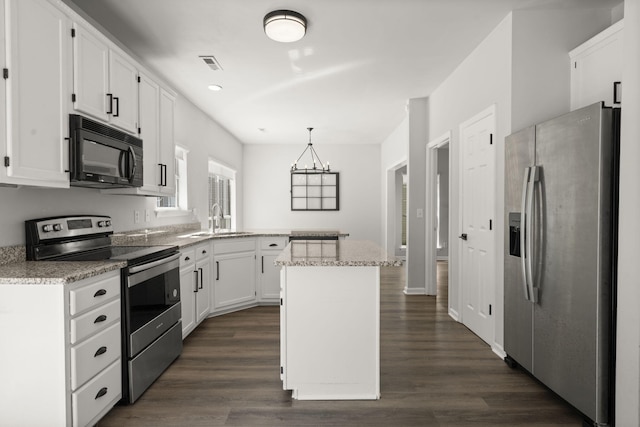 132 E Hartwick Ln, Goose Creek, SC 29445 - kitchen with visible vents, a sink, white cabinets, a peninsula, and stainless steel appliances