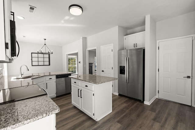 132 E Hartwick Ln, Goose Creek, SC 29445 - kitchen with white cabinets, appliances with stainless steel finishes, a sink, and dark wood-type flooring