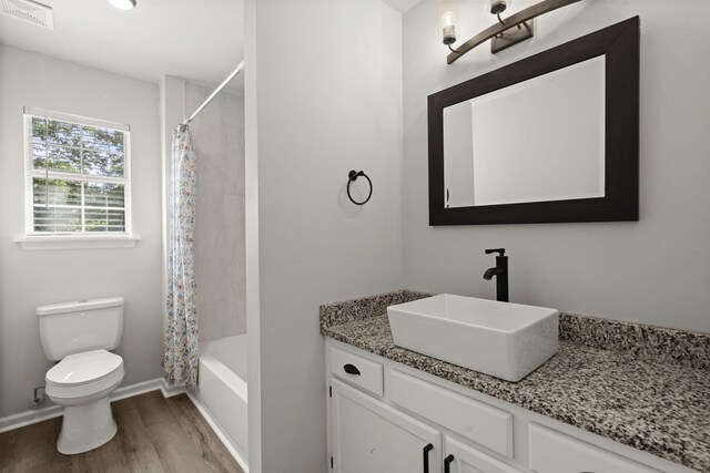 132 E Hartwick Ln, Goose Creek, SC 29445 - bathroom featuring vanity, toilet, baseboards, wood finished floors, and visible vents