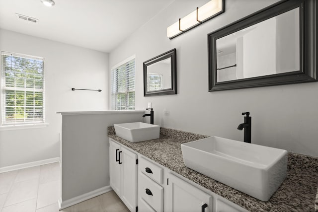 132 E Hartwick Ln, Goose Creek, SC 29445 - bathroom featuring visible vents, a sink, baseboards, and double vanity