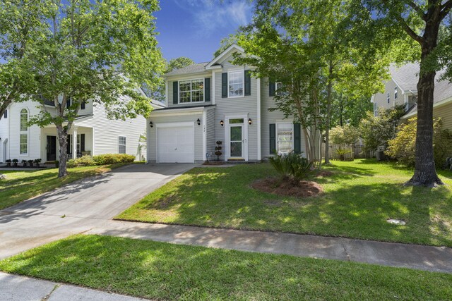 132 E Hartwick Ln, Goose Creek, SC 29445 - view of front of house featuring an attached garage, fence, driveway, and a front yard
