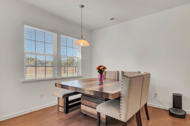 dining space featuring hardwood / wood-style floors