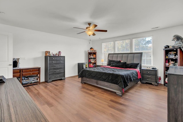 bedroom featuring ceiling fan and light hardwood / wood-style floors