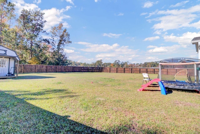 view of yard featuring a trampoline