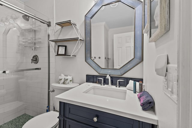 full bathroom with ornamental molding, a stall shower, vanity, and toilet