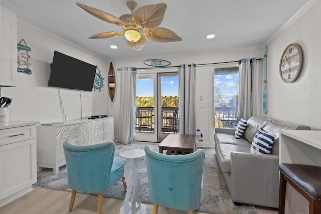 living area featuring ornamental molding, recessed lighting, light wood-style floors, and a ceiling fan