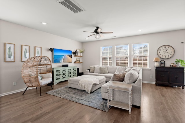 living room with ceiling fan and hardwood / wood-style floors