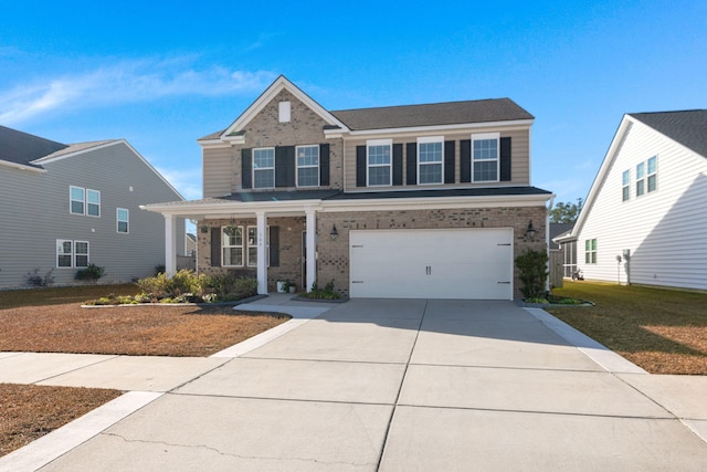 view of front facade featuring a garage and a front lawn