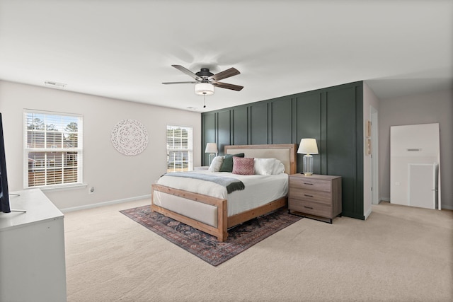 carpeted bedroom with ceiling fan