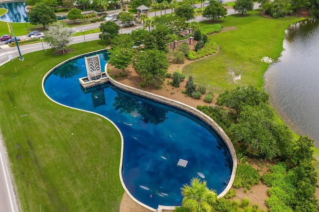 view of swimming pool with a water view