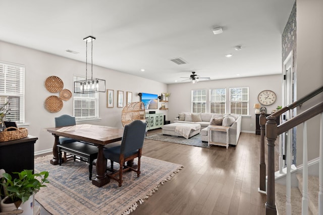 dining area featuring ceiling fan and dark hardwood / wood-style floors