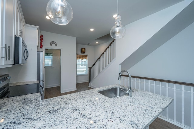 1242 Allusion Ln Unit 206, Mount Pleasant, SC 29466 - kitchen featuring a sink, stainless steel appliances, dark wood-type flooring, light stone counters, and recessed lighting