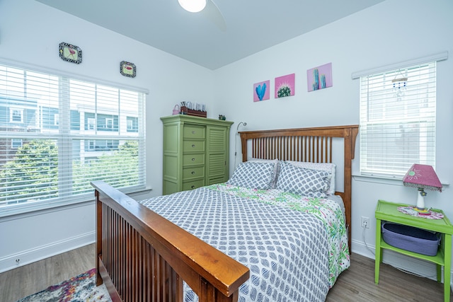 1242 Allusion Ln Unit 206, Mount Pleasant, SC 29466 - bedroom featuring multiple windows, baseboards, wood finished floors, and a ceiling fan