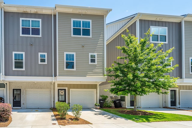 1242 Allusion Ln Unit 206, Mount Pleasant, SC 29466 - view of front of property with board and batten siding, driveway, and an attached garage