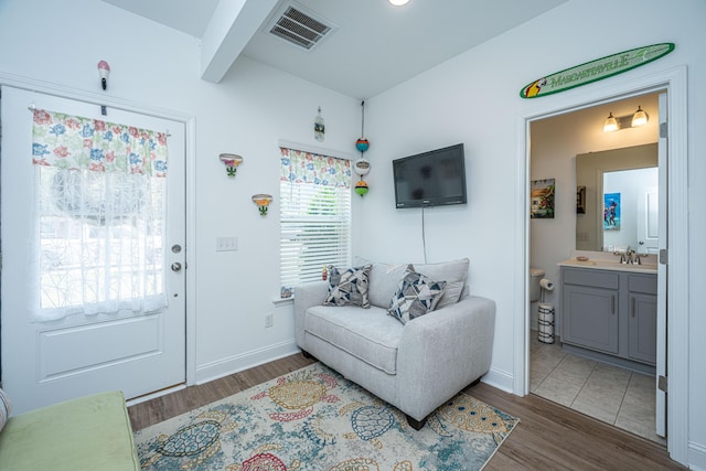 1242 Allusion Ln Unit 206, Mount Pleasant, SC 29466 - living room with wood finished floors, beamed ceiling, and baseboards