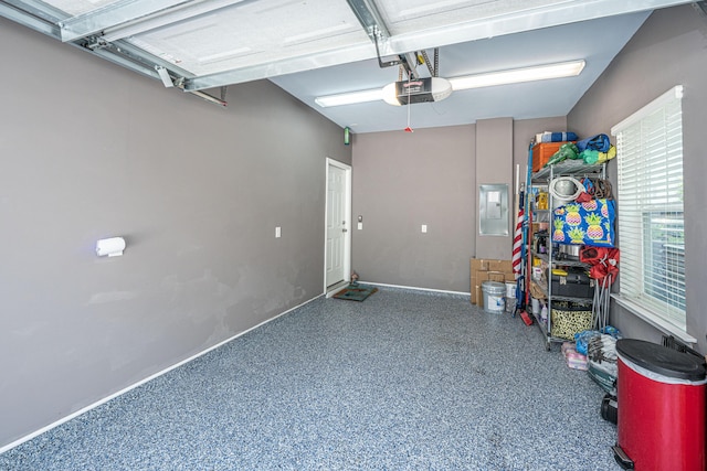 1242 Allusion Ln Unit 206, Mount Pleasant, SC 29466 - garage featuring electric panel, a garage door opener, and baseboards
