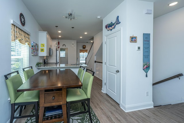 1242 Allusion Ln Unit 206, Mount Pleasant, SC 29466 - dining space featuring light wood-type flooring, stairway, baseboards, and recessed lighting